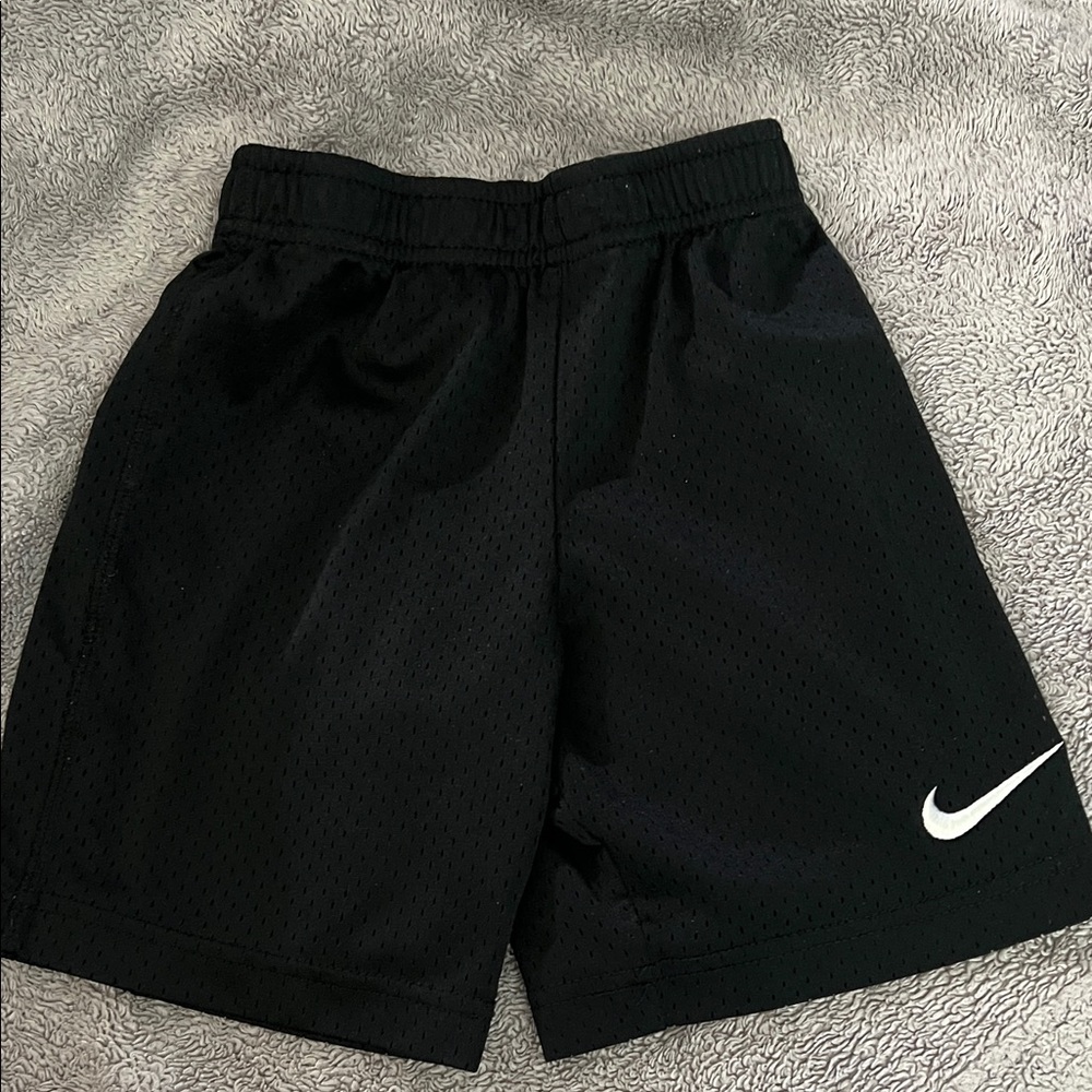 Nike Black Mesh Athletic Shorts with White Swoosh